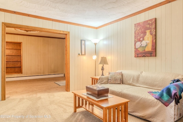 living room with a textured ceiling, baseboard heating, crown molding, carpet floors, and wood walls