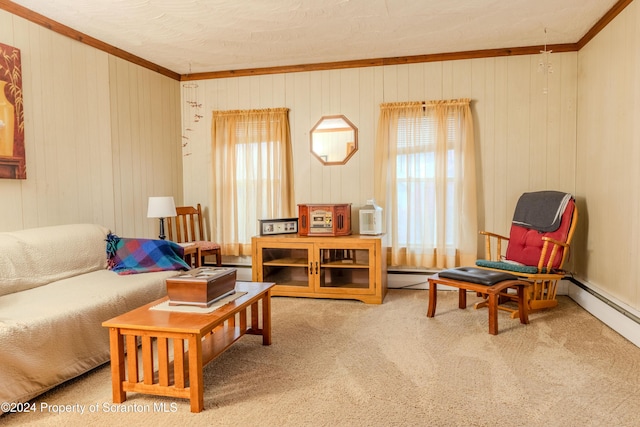 sitting room with carpet, wood walls, and crown molding