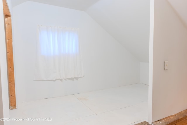 bathroom featuring vaulted ceiling