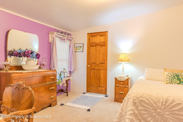 carpeted bedroom featuring lofted ceiling