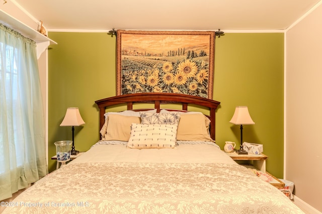 bedroom featuring crown molding