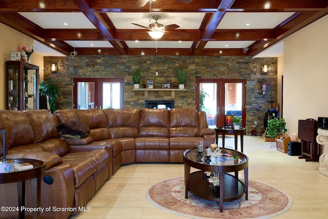 living room with beam ceiling, ceiling fan, french doors, and coffered ceiling