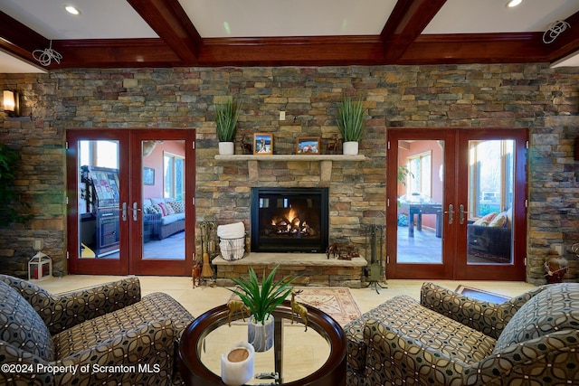 living room with beam ceiling, a fireplace, french doors, and coffered ceiling