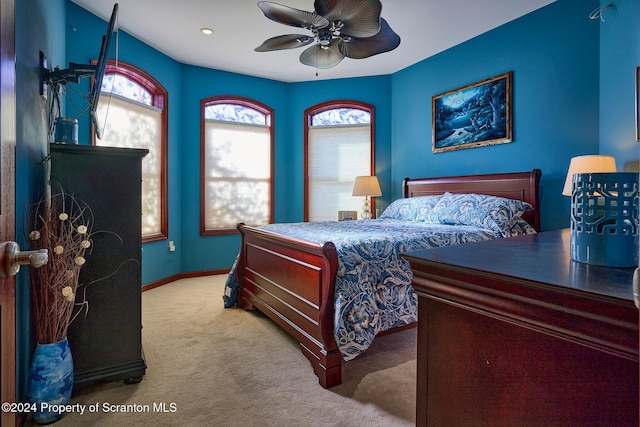 carpeted bedroom with ceiling fan