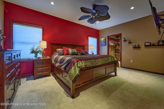 carpeted bedroom featuring ceiling fan