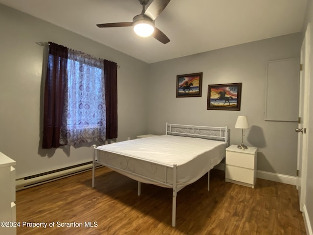 bedroom with a baseboard radiator, ceiling fan, and dark hardwood / wood-style floors