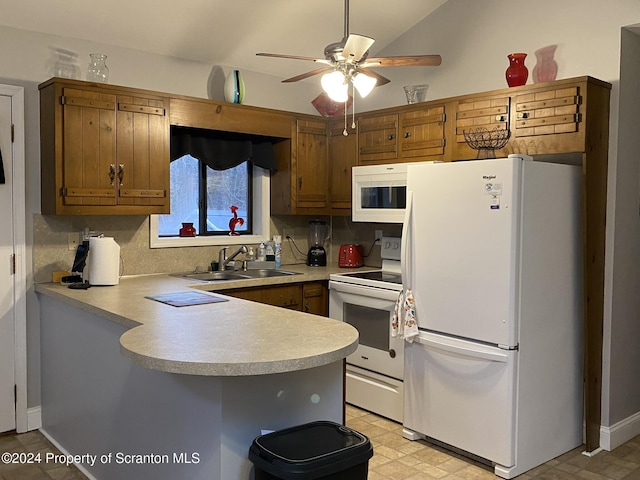 kitchen featuring kitchen peninsula, white appliances, sink, and tasteful backsplash