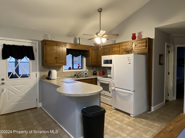 kitchen featuring ceiling fan, sink, kitchen peninsula, vaulted ceiling, and white appliances