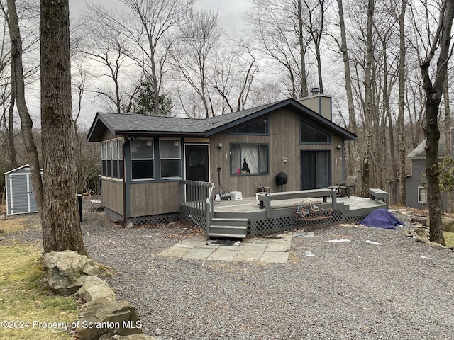 view of front of house featuring a deck and a sunroom