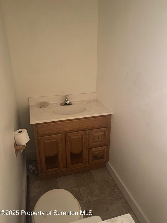 bathroom featuring toilet and vanity