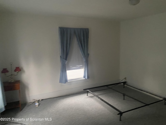 unfurnished bedroom with carpet flooring