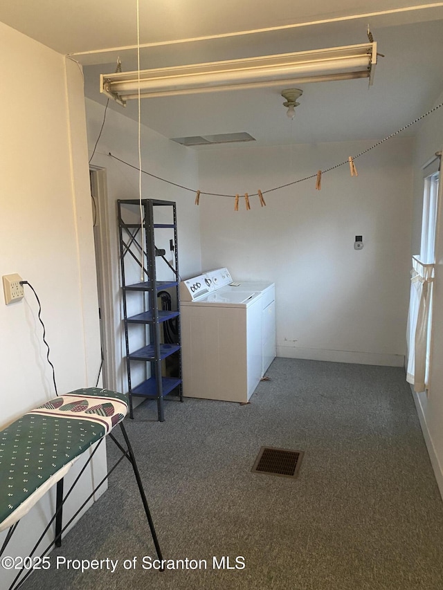 washroom featuring carpet floors and independent washer and dryer