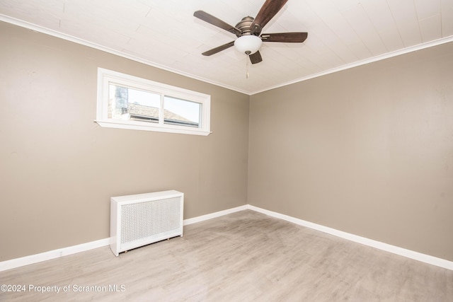 unfurnished room featuring light hardwood / wood-style flooring, radiator, crown molding, and ceiling fan