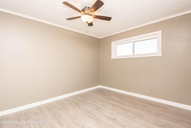 empty room featuring ceiling fan, light hardwood / wood-style floors, and ornamental molding