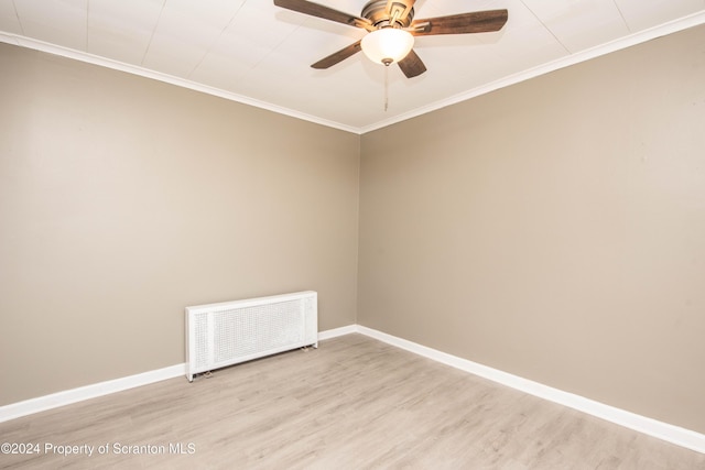 unfurnished room with wood-type flooring, ceiling fan, ornamental molding, and radiator