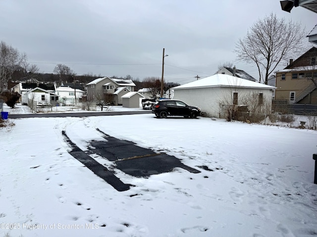 view of yard covered in snow