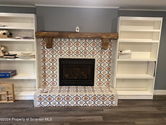 room details featuring hardwood / wood-style flooring, ornamental molding, and a tile fireplace