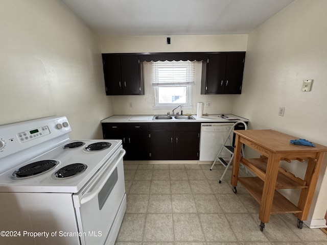 kitchen with sink and white appliances