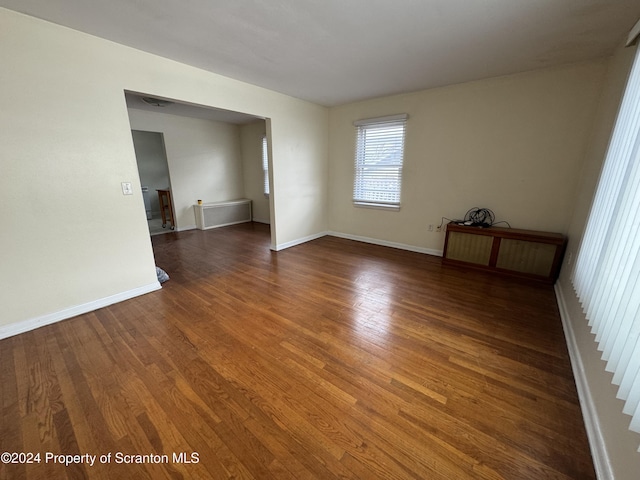 empty room featuring dark hardwood / wood-style floors