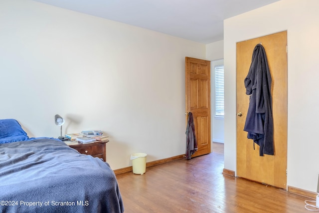 bedroom featuring hardwood / wood-style flooring