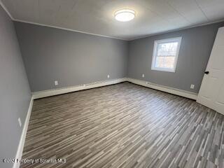 unfurnished bedroom with wood-type flooring