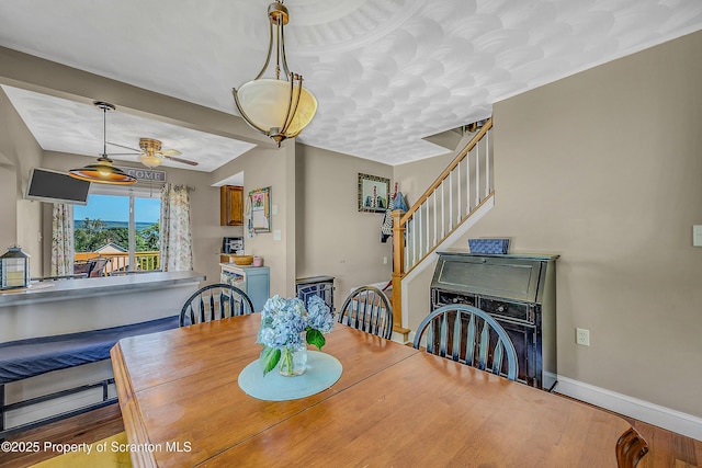 132 6th St, Blakely, PA 18447 - dining area with stairway and ceiling fan