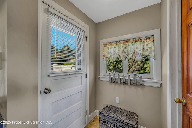 132 6th St, Blakely, PA 18447 - doorway to outside featuring baseboards