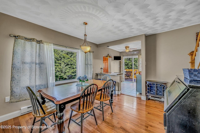 132 6th St, Blakely, PA 18447 - dining space with plenty of natural light, light wood-style flooring, and a ceiling fan