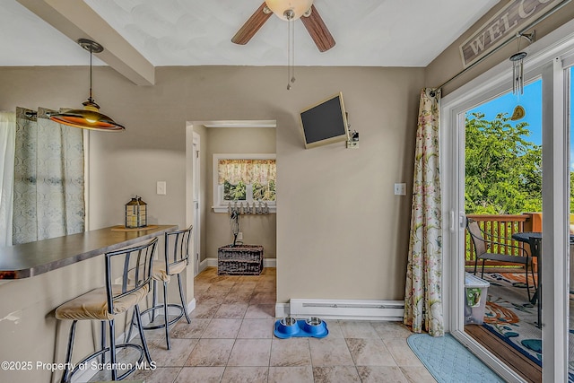 132 6th St, Blakely, PA 18447 - dining space featuring healthy amount of natural light, a ceiling fan, light tile patterned floors, and a baseboard radiator