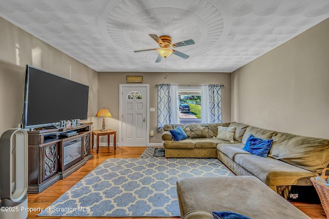 132 6th St, Blakely, PA 18447 - living area with a ceiling fan and light wood finished floors