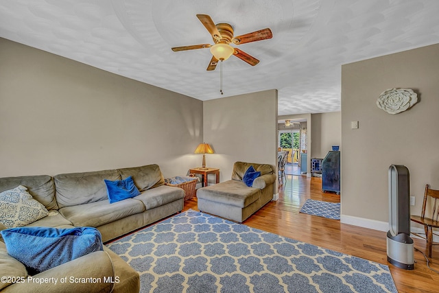 132 6th St, Blakely, PA 18447 - living room with a ceiling fan and wood finished floors