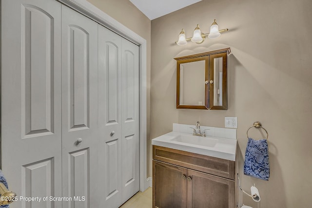 132 6th St, Blakely, PA 18447 - bathroom with a closet, vanity, and tile patterned floors
