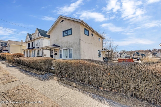 view of home's exterior with stucco siding