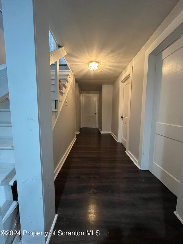 corridor featuring dark hardwood / wood-style floors