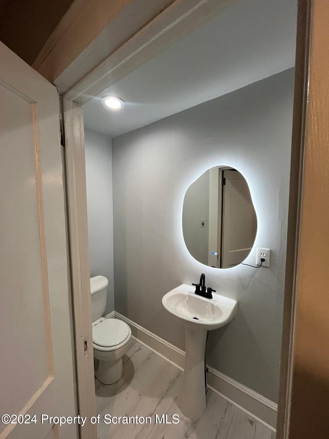 bathroom featuring toilet