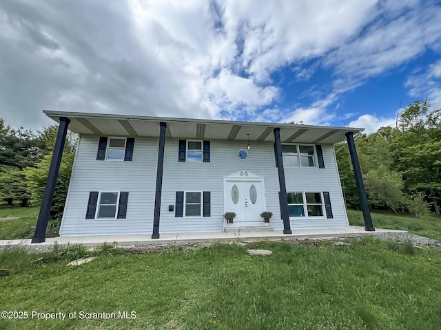 1446 Main St, Friendsville, PA 18818 - view of front facade with covered porch and a front yard