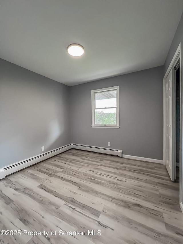 1446 Main St, Friendsville, PA 18818 - unfurnished bedroom featuring wood finished floors, baseboards, and a closet