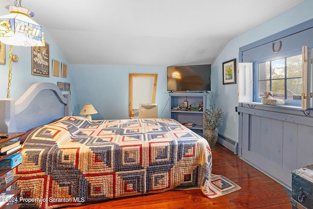 bedroom with dark hardwood / wood-style flooring, a baseboard radiator, and vaulted ceiling