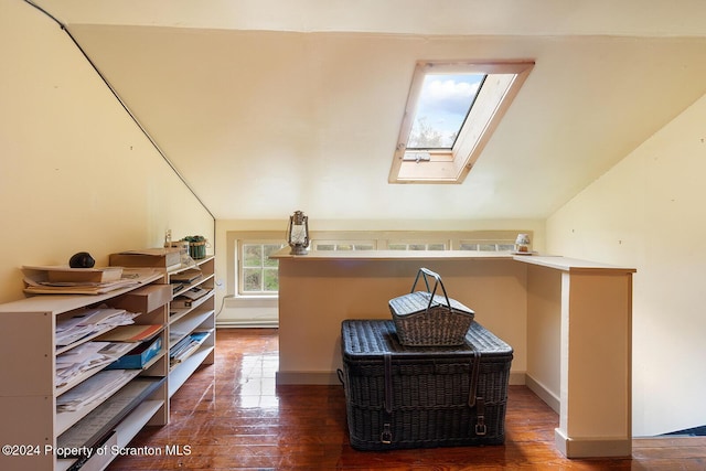 additional living space with vaulted ceiling with skylight