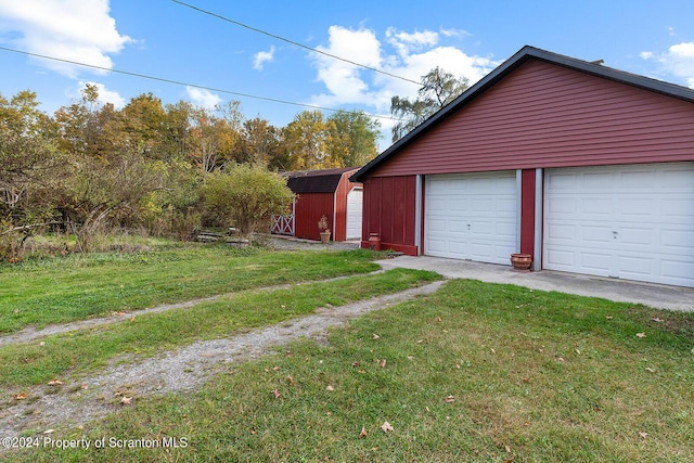 garage with a lawn