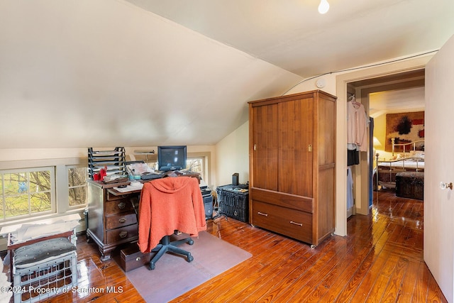 office area with dark hardwood / wood-style flooring and lofted ceiling