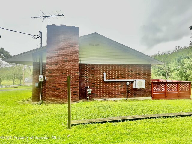 13 Mundro Rd, Scott Twp, PA 18447 - view of side of home featuring a lawn, a chimney, and brick siding