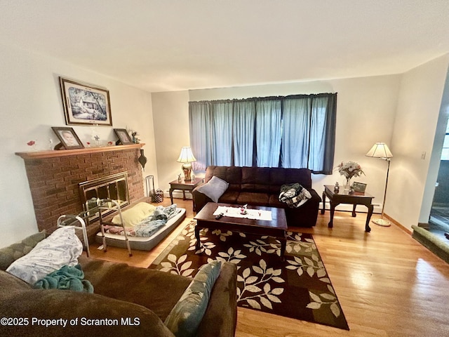 13 Mundro Rd, Scott Twp, PA 18447 - living room featuring wood finished floors and a brick fireplace