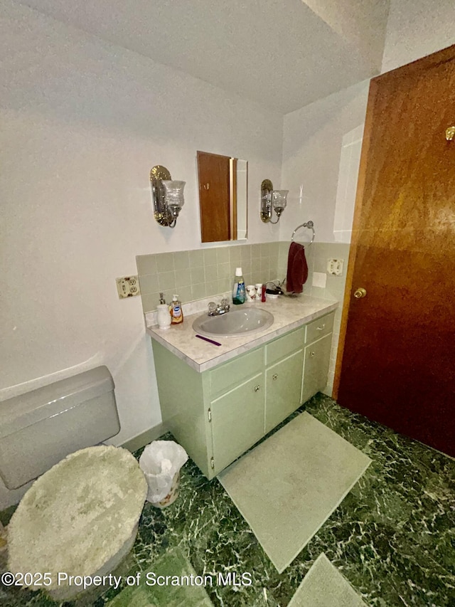 13 Mundro Rd, Scott Twp, PA 18447 - half bathroom with decorative backsplash, vanity, and marble finish floors