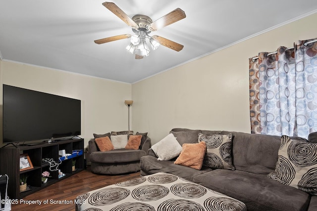 living room featuring wood-type flooring, ceiling fan, and crown molding