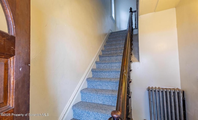 staircase with radiator heating unit