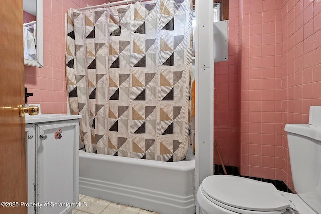 full bathroom featuring tile patterned floors, vanity, toilet, and shower / tub combo