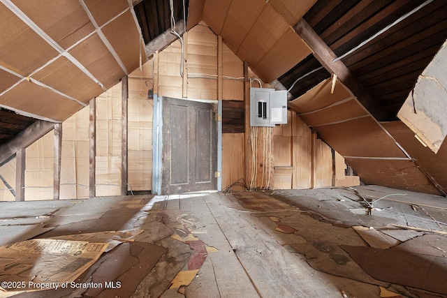 unfinished attic with electric panel