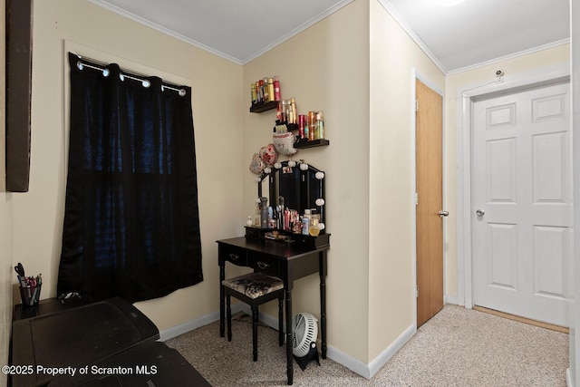 carpeted foyer entrance featuring ornamental molding and baseboards