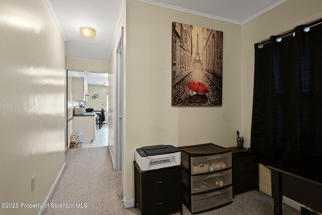 hallway with ornamental molding, carpet flooring, and baseboards